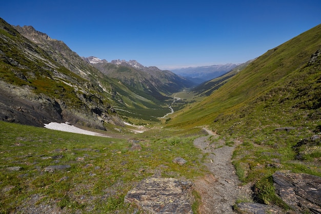 Morning in the mountains, a fabulous landscape of the Caucasus mountains. Hike climbing mountains, peaks and snowy peaks. Clean fresh air on a Sunny morning among the rocks