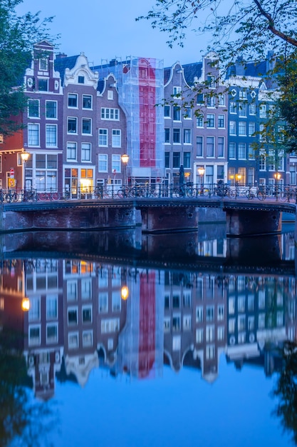 Morning Reflections of Amsterdam Houses and Bridge