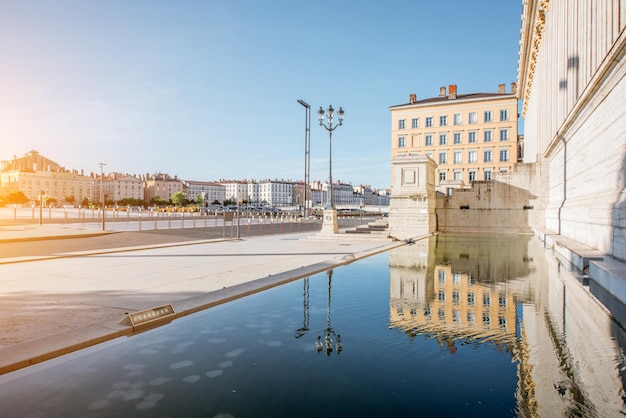 Morning street view with neo-classical palace and beautiful riverside in the old town of Lyon