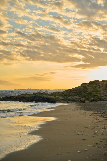 Morning sunrise at sea natural seascape the Greek city of Chania Crete on the horizon