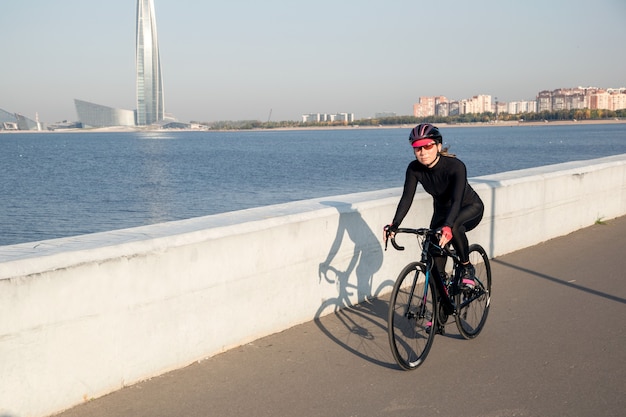 Morning training of a cyclist on the waterfront of the Gulf of Finland