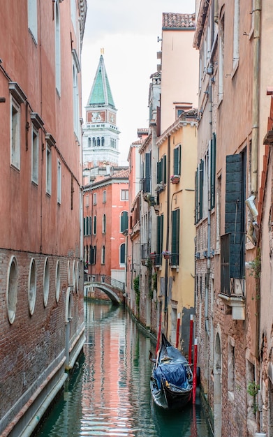 Morning in Venice water channels along residential buildings cityscape