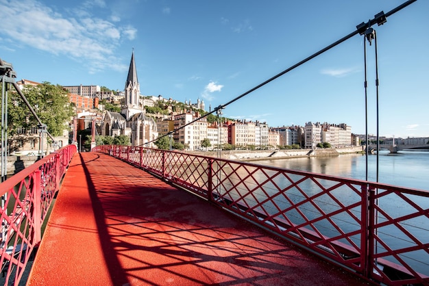 Morning view on the red footbridge and the riverside in the old town of Lyon city