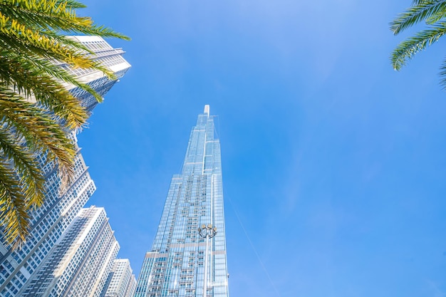 Morning view with sunny and green trees at Landmark 81 it is a super tall skyscraper with development buildings along Saigon river in Ho Chi Minh city Vietnam Business travel concept