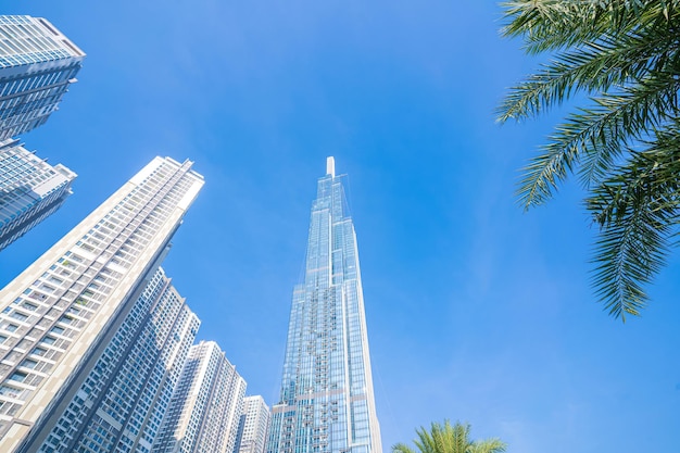 Morning view with sunny and green trees at Landmark 81 it is a super tall skyscraper with development buildings along Saigon river in Ho Chi Minh city Vietnam Business travel concept