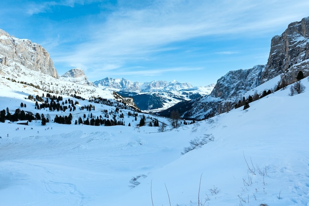 Morning winter rocky mountain landscape with serpentine road . Gardena Pass in Dolomites of South Tyrol in northeast Italy