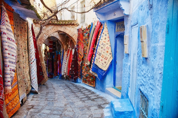 Morocco is the blue city of Chefchaouen, endless streets painted in blue color. Lots of flowers and Souvenirs in the beautiful streets of Chefchaouen. A magical fairy-tale city of heavenly color