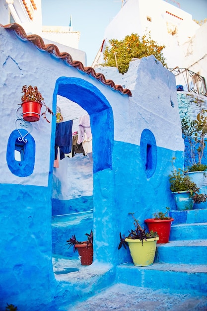 Morocco is the blue city of Chefchaouen, endless streets painted in blue color. Lots of flowers and Souvenirs in the beautiful streets of Chefchaouen. A magical fairy-tale city of heavenly color