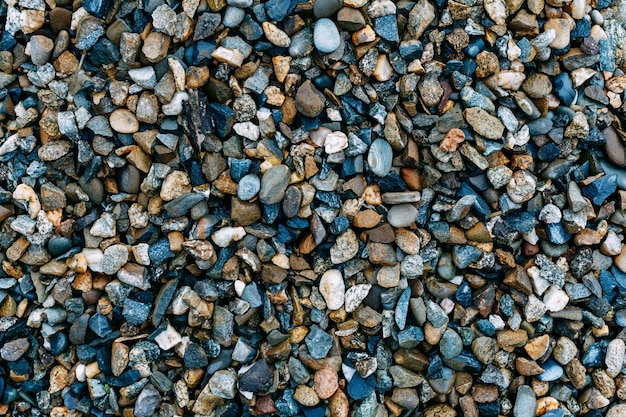 Mosaic sea pebbles background Texture of small marine multicolored pebbles