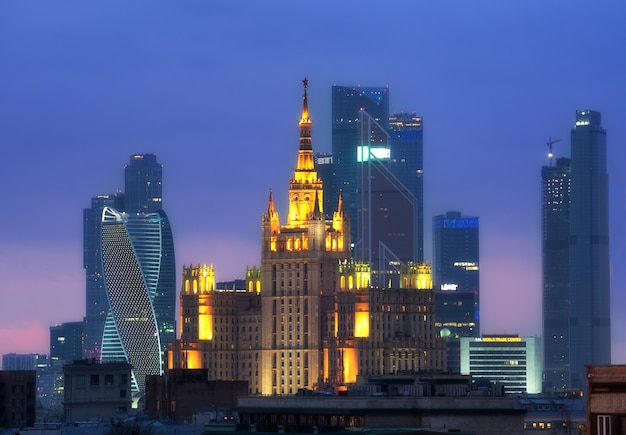 Moscow Business City and Stalin skyscraper building night aerial panorama