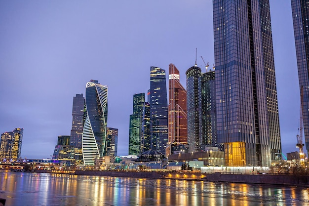 Moscow City International Business Centre skyscraper buildings with panoramic windows night view.