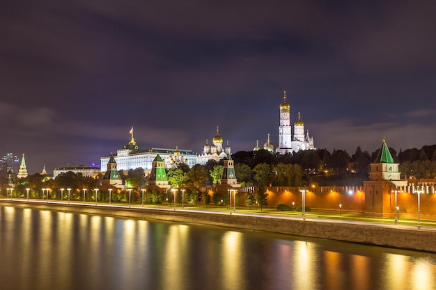 Moscow Kremlin, Ivan the Great Bell Tower, Grand Kremlin Palace and Moscow river at night with traffic trails.