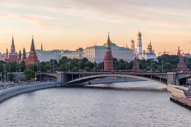 Moscow Kremlin and Moscow River in the sunny evening. Pink and golden sky. Russia