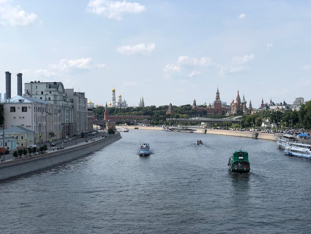 Moscow summertime cityscape with Kremlin on a sunny day Russian landmark Moscow river and boats