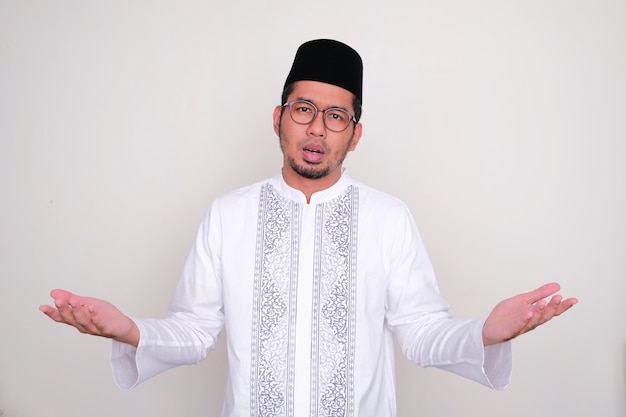 Moslem Asian man showing confused expression when trying to decide something