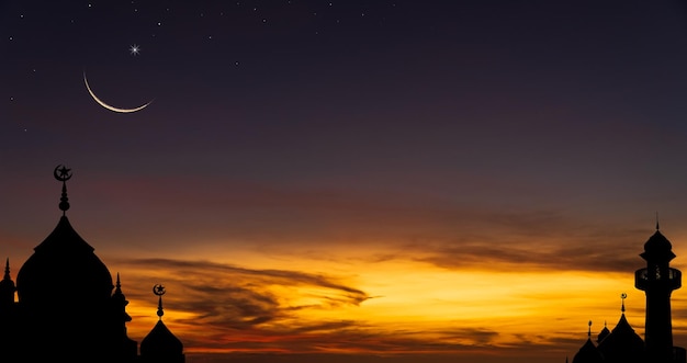 Mosques dome on dusk sky in the evening twilight and crescent moon religion symbol of Islamic