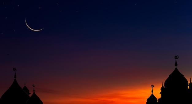 Mosques dome on dusk sky in the evening twilight and crescent moon religion symbol of Islamic