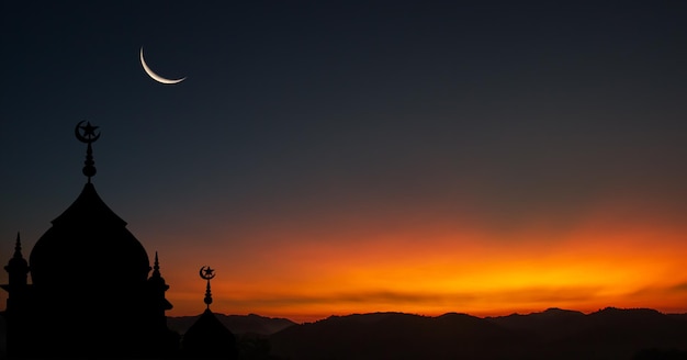 Mosques dome on dusk sunset sky and crescent moon symbol religion of Islamic free space text