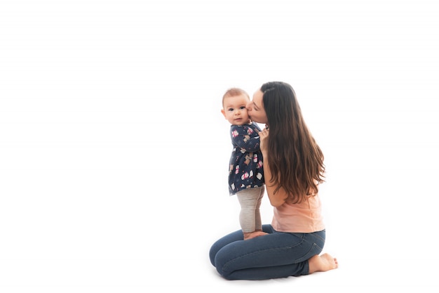 A mother and baby bonding together isolated on white background