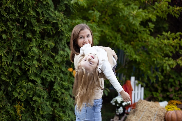 Mother and child are playing outdoor in nature