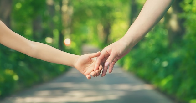 Mother and child holding hands