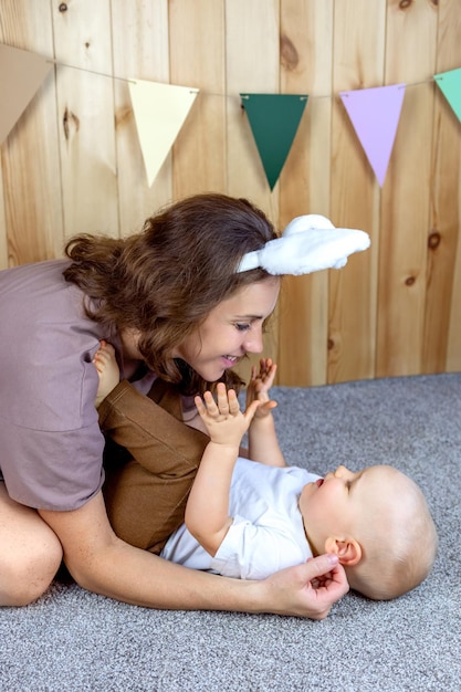 Mother and child hug and play Easter holiday