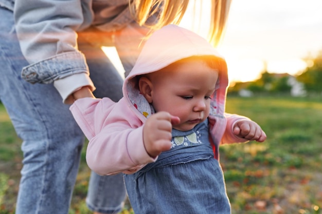 Mother and child walk in the park in the evening