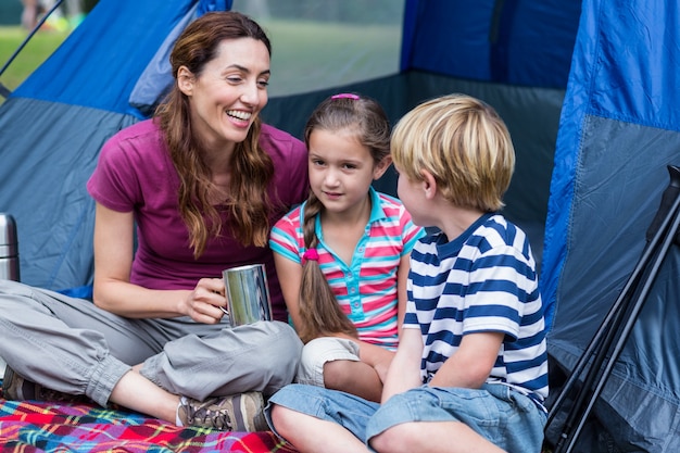 mother and children having fun in the park