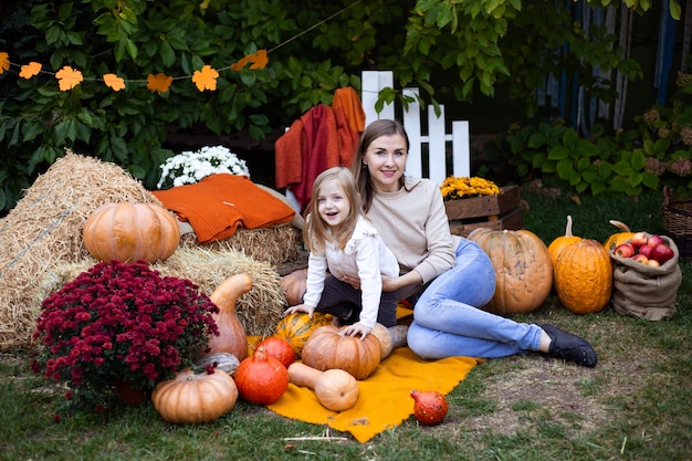 Mother and daughter in autumn background