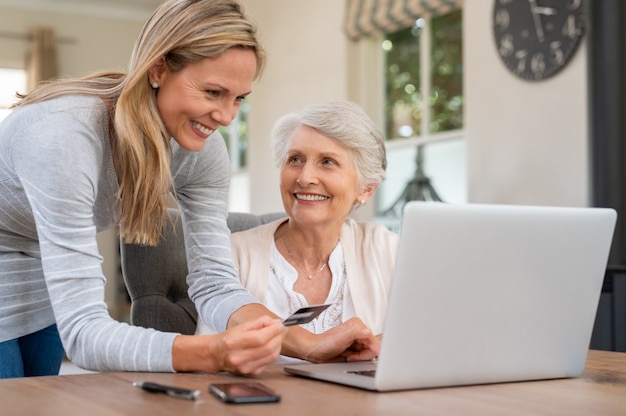 Mother and daughter doing shopping online