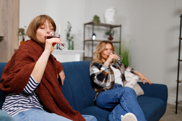 Mother and daughter drinking wine together