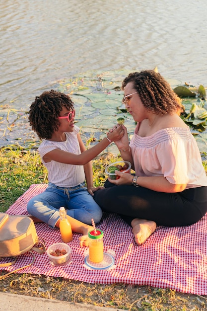 Mother and daughter eating healthy salad