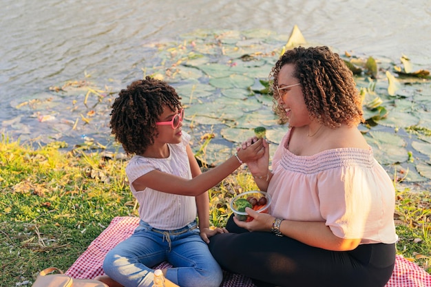 Mother and daughter eating vegan