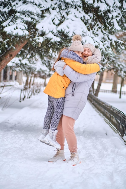 Mother and daughter enjoying beautiful winter day