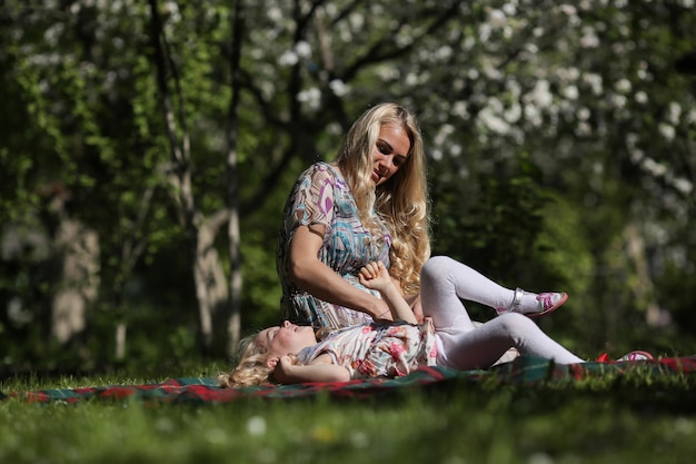 Mother and daughter in the garden