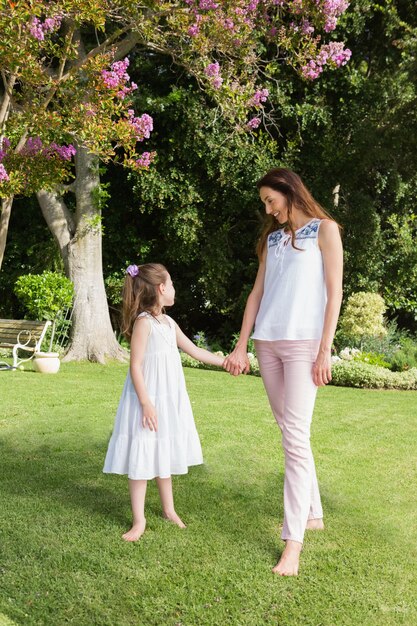 Mother and daughter holding hands