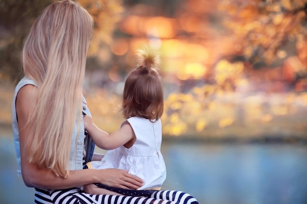 Mother and daughter look, seen from behind