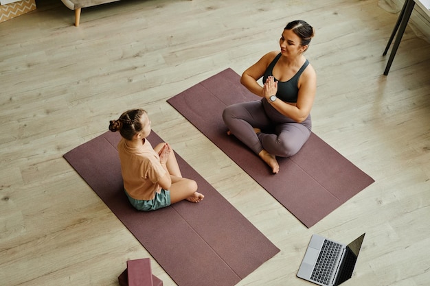 Mother and Daughter Meditating Together