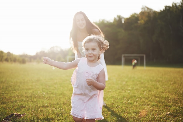 Mother and daughter playing outside