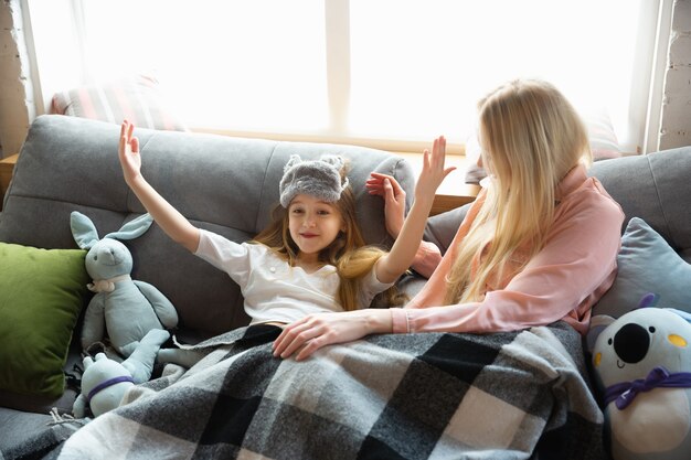 Mother and daughter, sisters have quite, beauty and fun day together at home