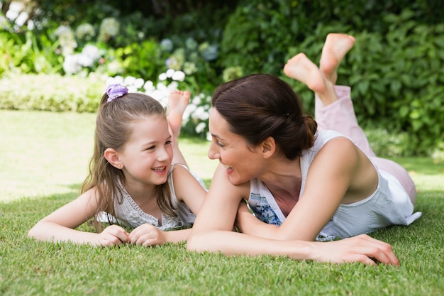 Mother and daughter smiling at each other