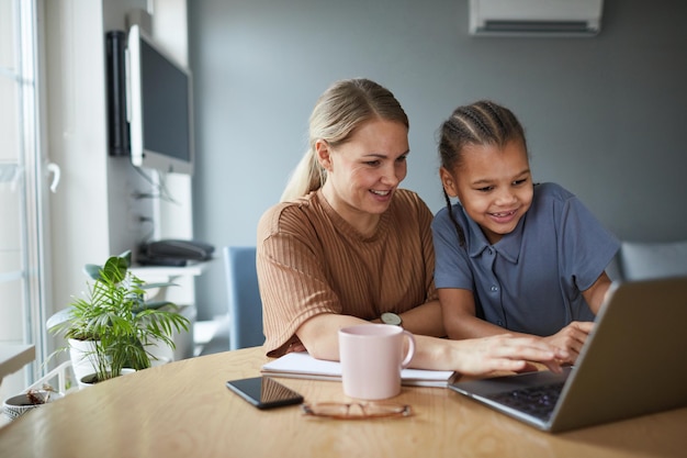 Mother and Daughter using Laptop Together