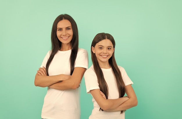 Mother and daughter in white shirt happy childhood and motherhood concept of friendship happy family day portrait teen girl child with mom family values and togetherness positive smile