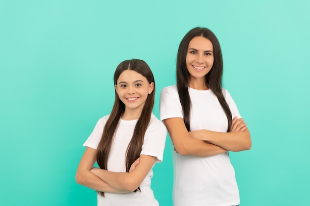 Mother and daughter in white shirt happy childhood and motherhood concept of friendship happy family day portrait teen girl child with mom family values and togetherness positive smile