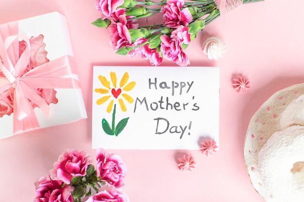 Mother day card on pink background. Text Happy Mothers day.