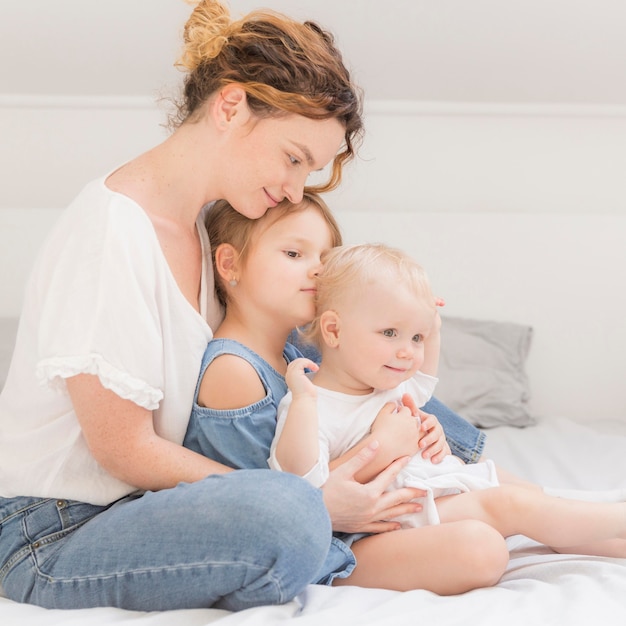 Mother enjoying time with children at home