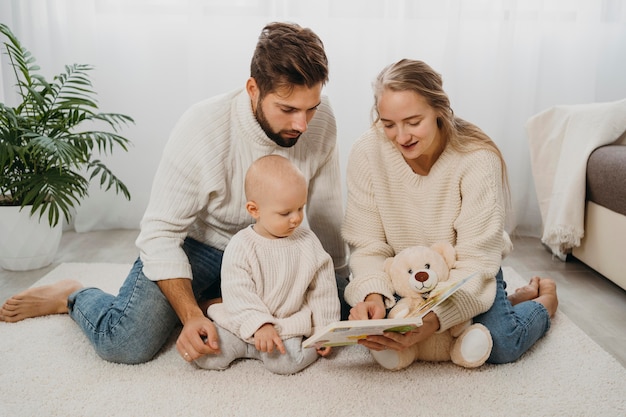 Mother and father at home with their baby