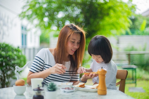 Mother have breakfast with her children family time