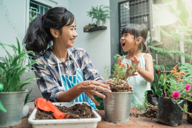 Mother and her daughter gardening together