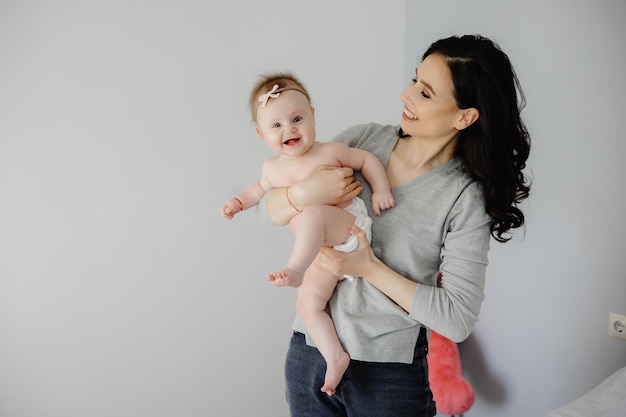 A mother holding her baby in her arms